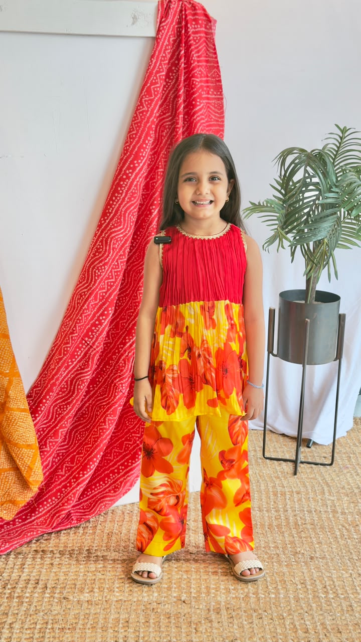 Red & Yellow Floral Plazo Set - girl wearing red pleated top with yellow red floral plazo pants