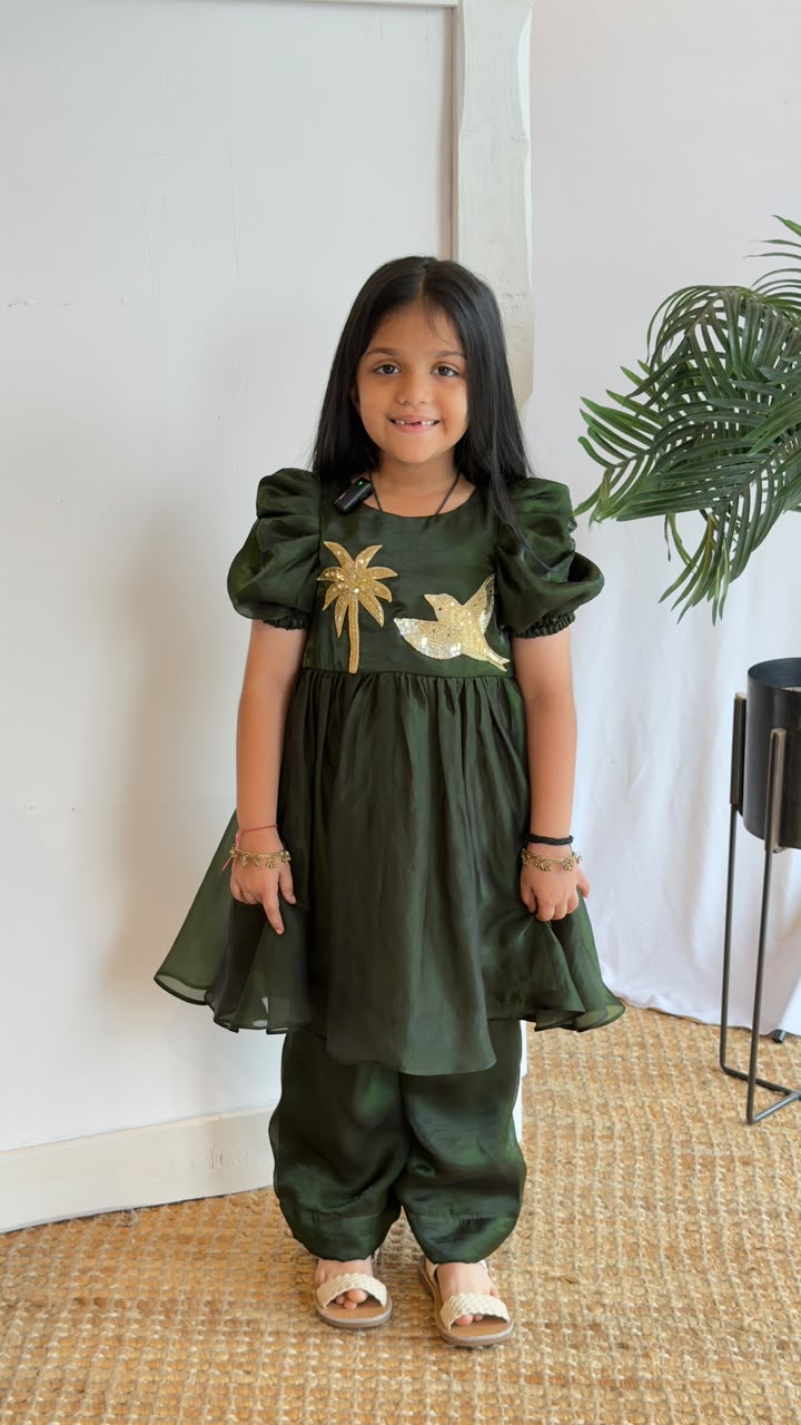 Emerald Green Puff Sleeve Kurta & Plazo Set - girl wearing deep green kurta with gold sequin appliqué and matching plazo pants