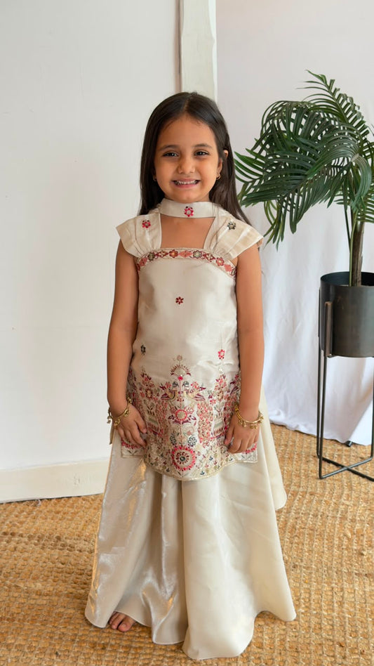Ivory Bloom Embroidered Kurta & Sharara Set - girl wearing ivory silk kurta with floral embroidery and matching sharara pants