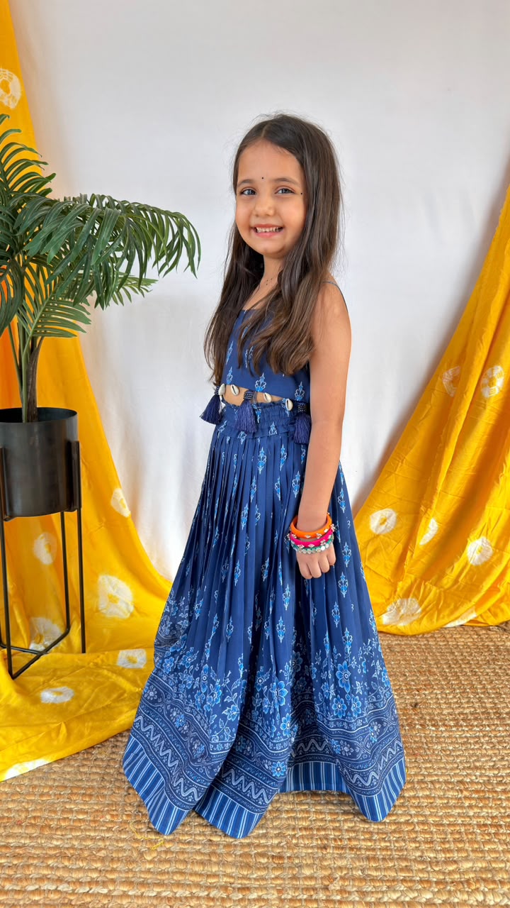 Side view of a girl wearing the navy blue printed lehenga choli set