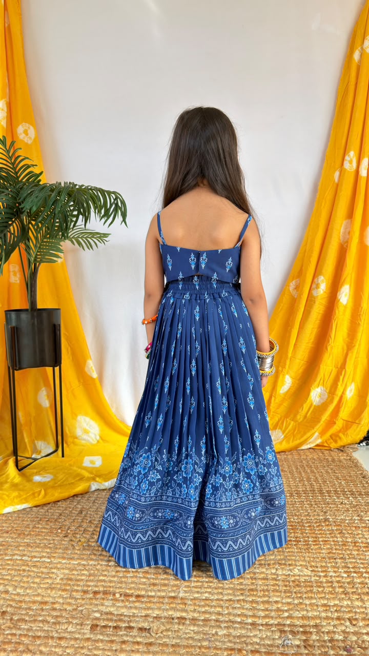 Front view of the navy blue printed girls’ lehenga choli set with decorative skirt border