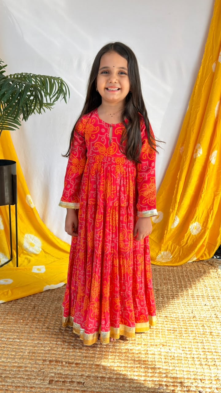 Back view of a red printed girls’ Anarkali dress with long sleeves and a full-length skirt
